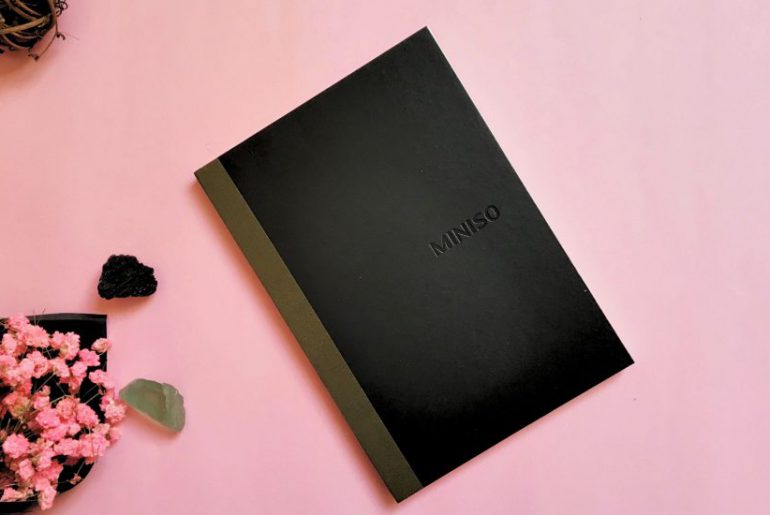 notebook on a pink background